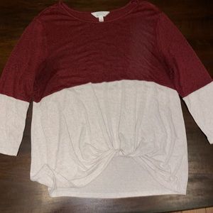 Tie-front sweater with 3/4 length sleeves.